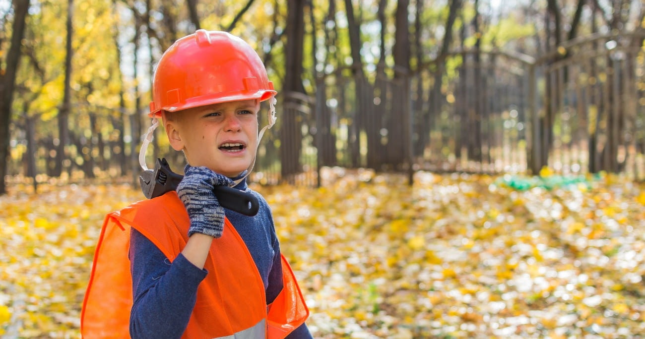 a young boy with construction gear